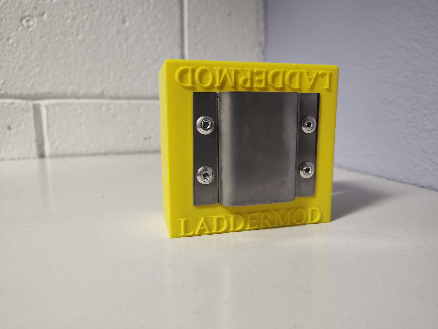 LadderMod (YELLOW) is designed to slide into the front, back, right, or left side rail of a standard ladder.