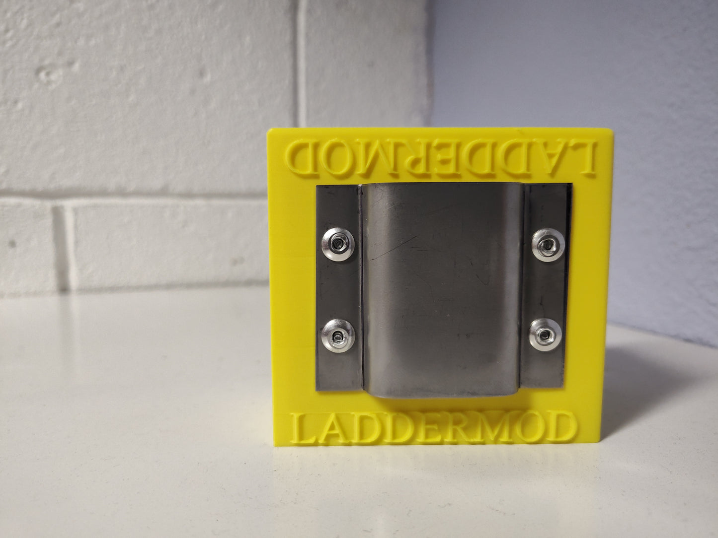 LadderMod (YELLOW) is designed to slide into the front, back, right, or left side rail of a standard ladder.