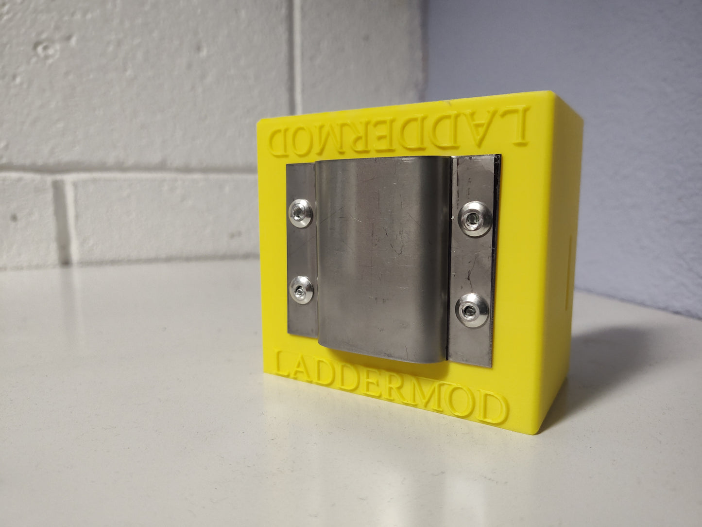 LadderMod (YELLOW) is designed to slide into the front, back, right, or left side rail of a standard ladder.