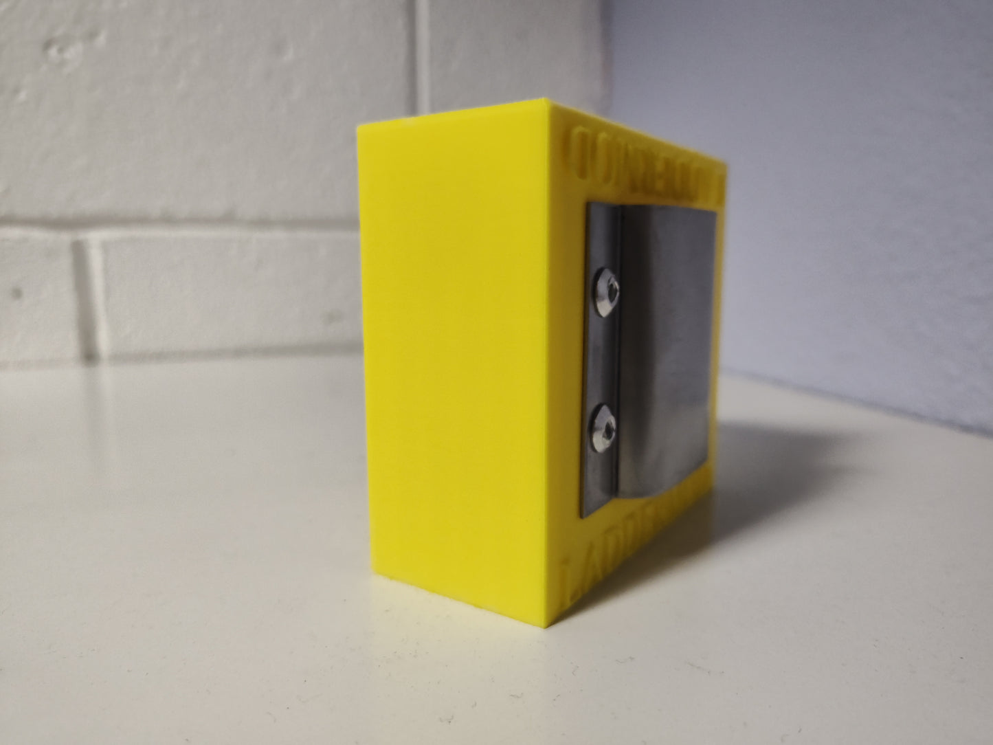 LadderMod (YELLOW) is designed to slide into the front, back, right, or left side rail of a standard ladder.